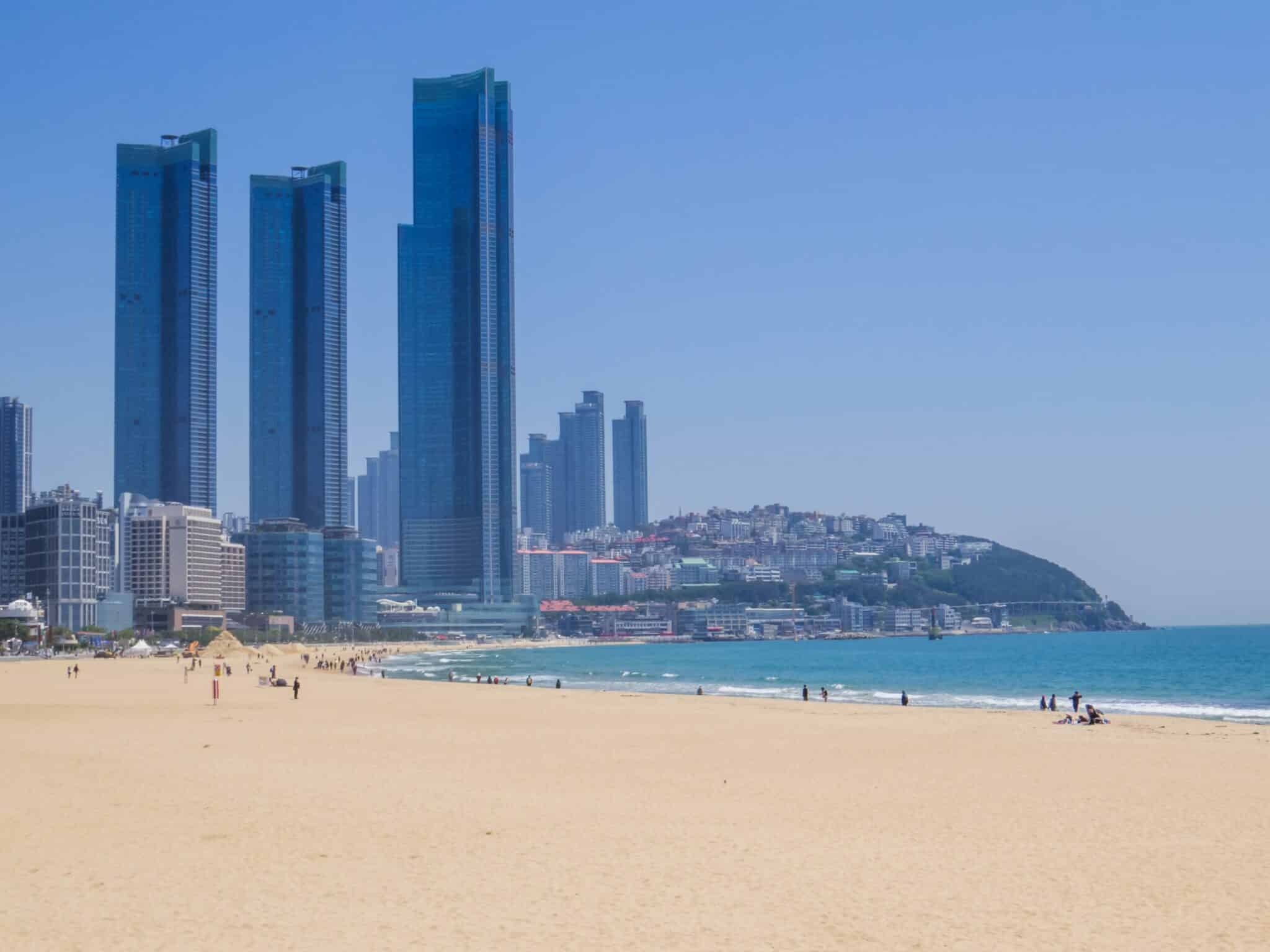 Haeundae Beach with tall skyscrapers and coastline in Busan