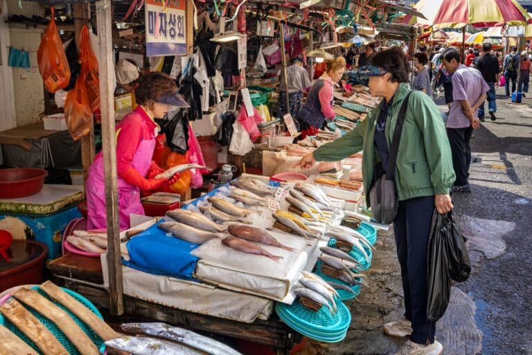 Vendors selling fresh seafood at Jagalchi Fish Market in Busan