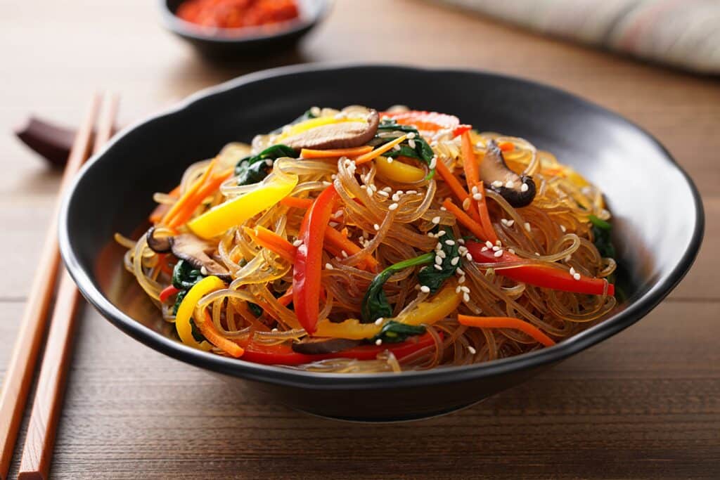 Japchae Korean glass noodles with vegetables and sesame seeds