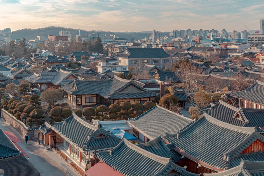 Aerial view of Jeonju Hanok Village with traditional Korean rooftops and modern city skyline