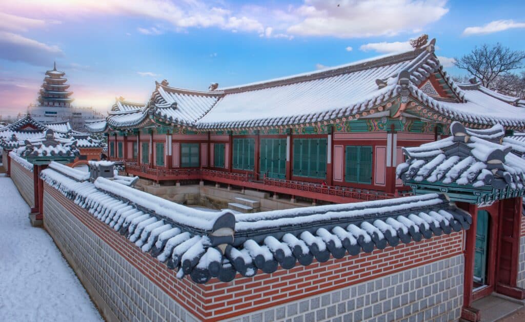 Traditional Korean palace covered in snow during winter in Seoul