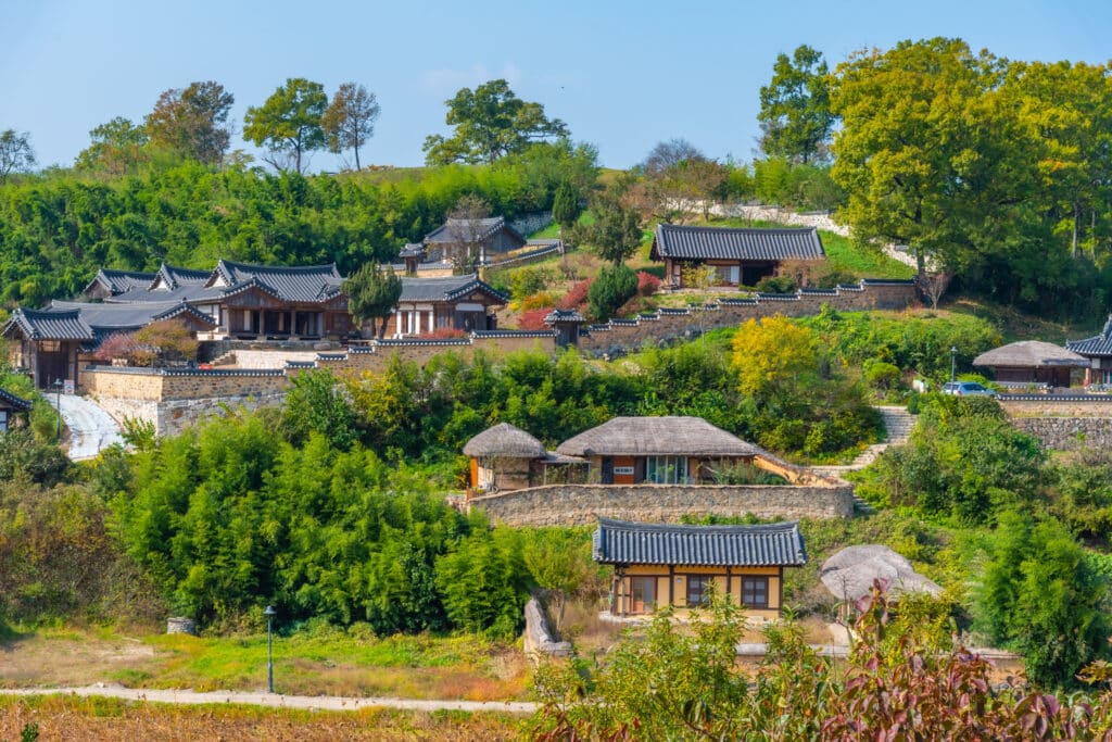 Traditional Korean village with hanok houses and green hills