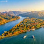 Aerial view of Nami Island surrounded by water and autumn foliage in South Korea