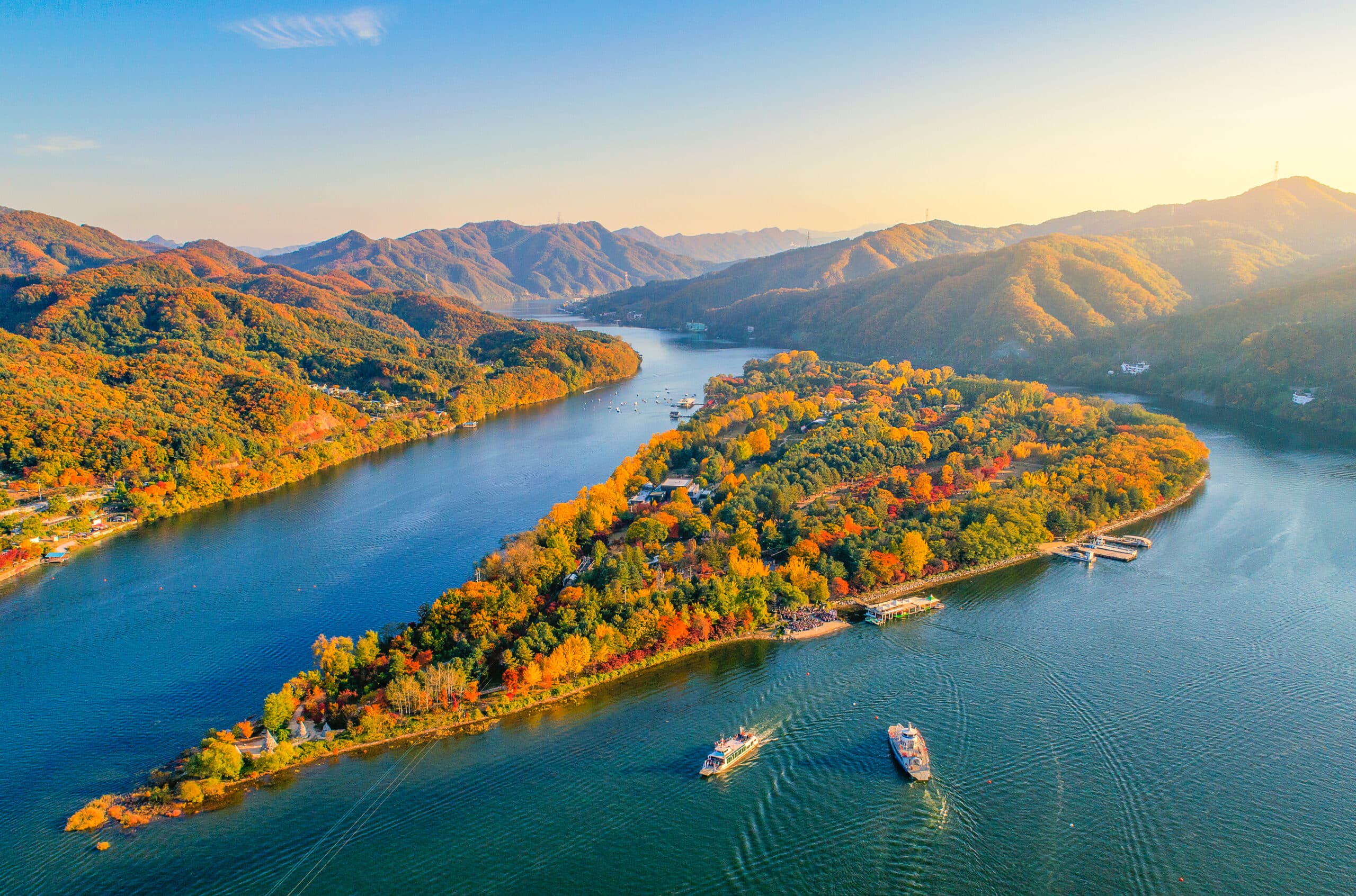 Aerial view of Nami Island surrounded by water and autumn foliage in South Korea