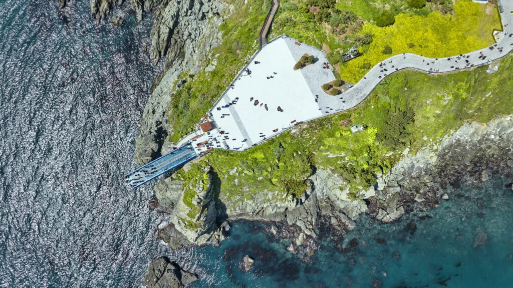 Oryukdo Skywalk glass platform over rocky coastline in Busan