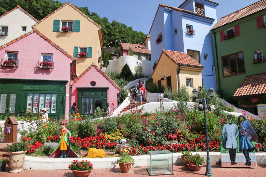 Colorful hillside buildings and flower gardens at Petite France in Gapyeong