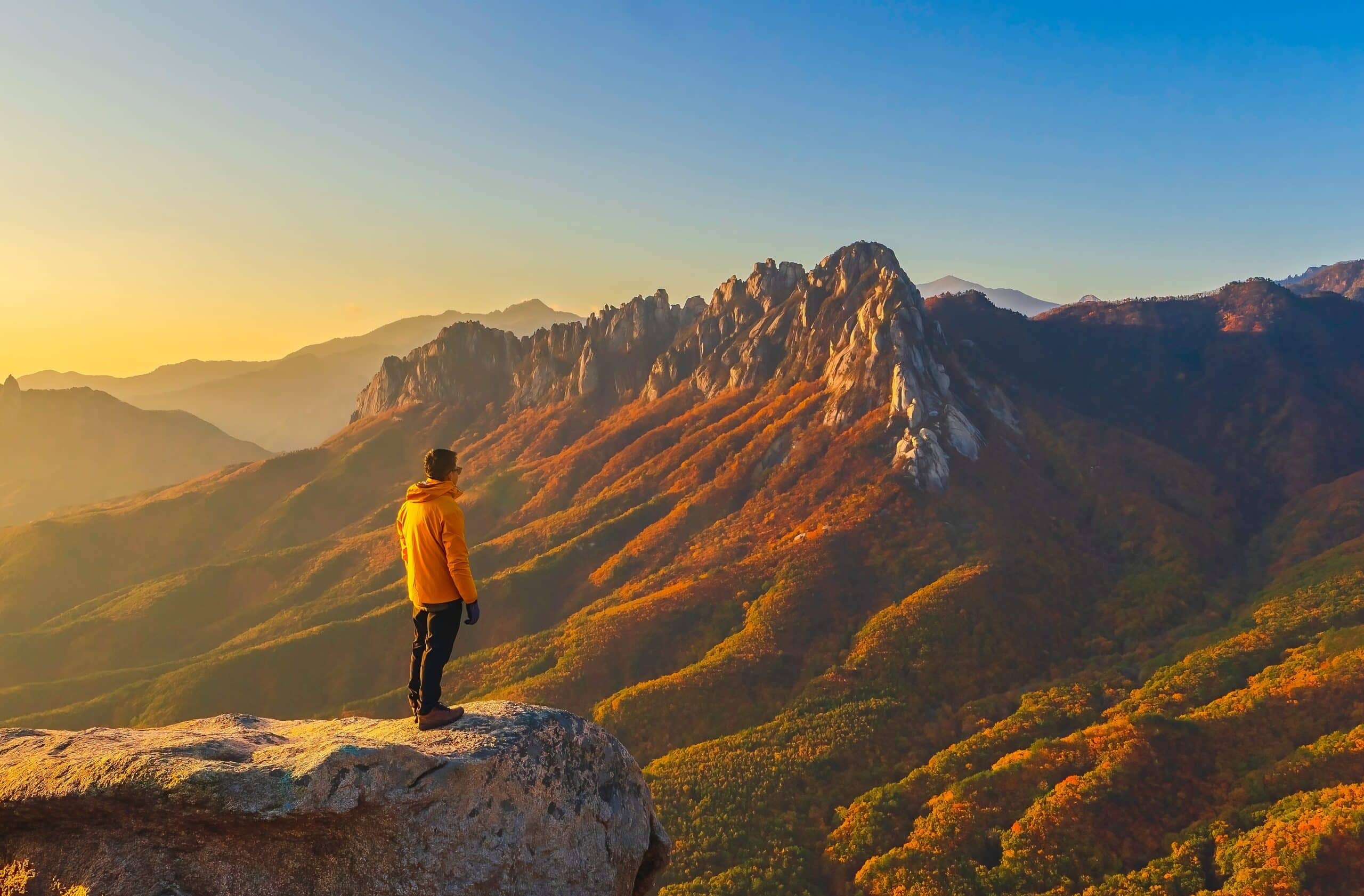 Hiker overlooking autumn mountains in Seoraksan National Park South Korea