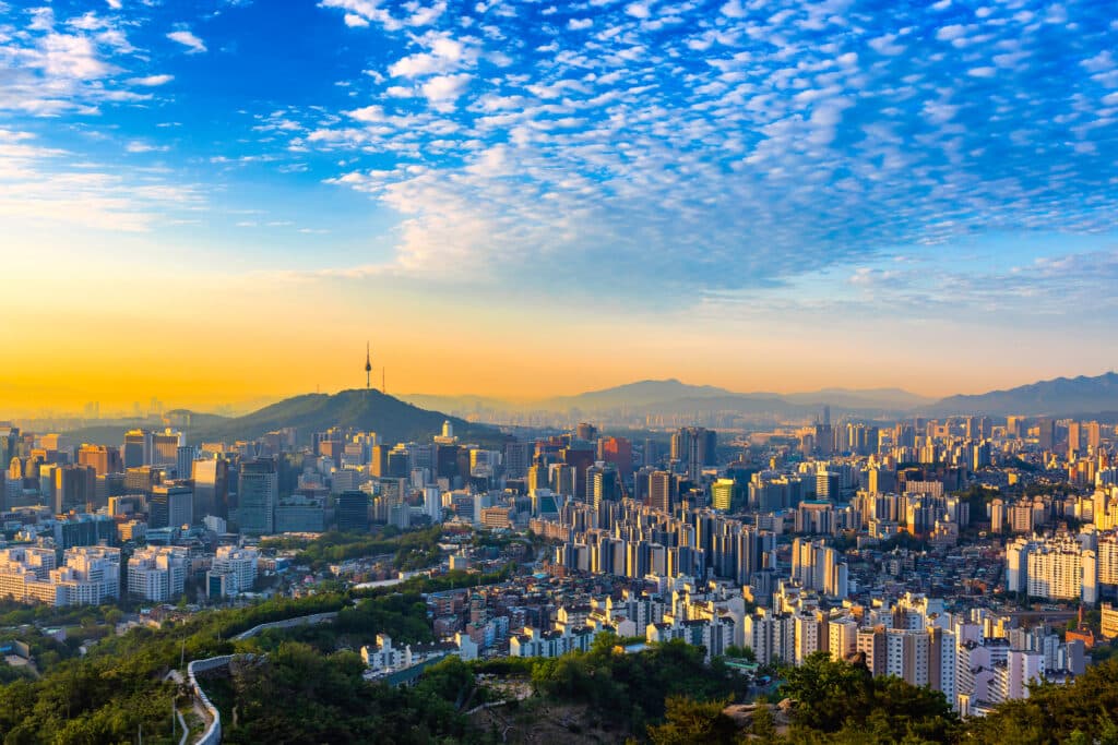 Panoramic skyline view of Seoul with Namsan Seoul Tower at sunrise