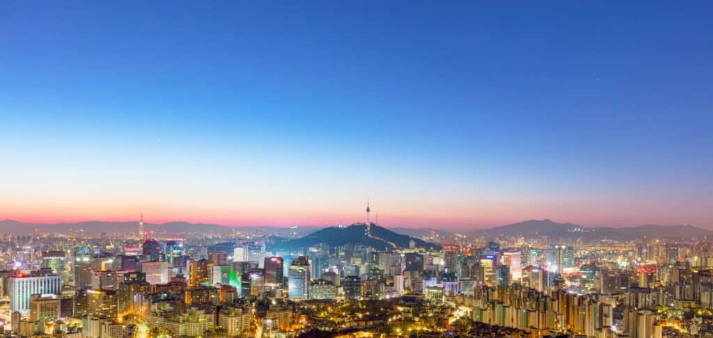 Panoramic skyline of Seoul at dusk with N Seoul Tower on Namsan Mountain