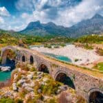 Beautiful spring view of Old Mes Bridge. Colorful morning landscape of Shkoder. Amazing outdoor scene of Albania, Europe. Traveling concept background.