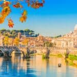 St. Peter's cathedral over bridge and river water at fall day Rome, Italy