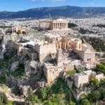 Aerial drone photo of iconic Acropolis hill and the Parthenon featuring Erechtheion and Porch of the Caryatids, Athens historic centre, Attica, Greece
