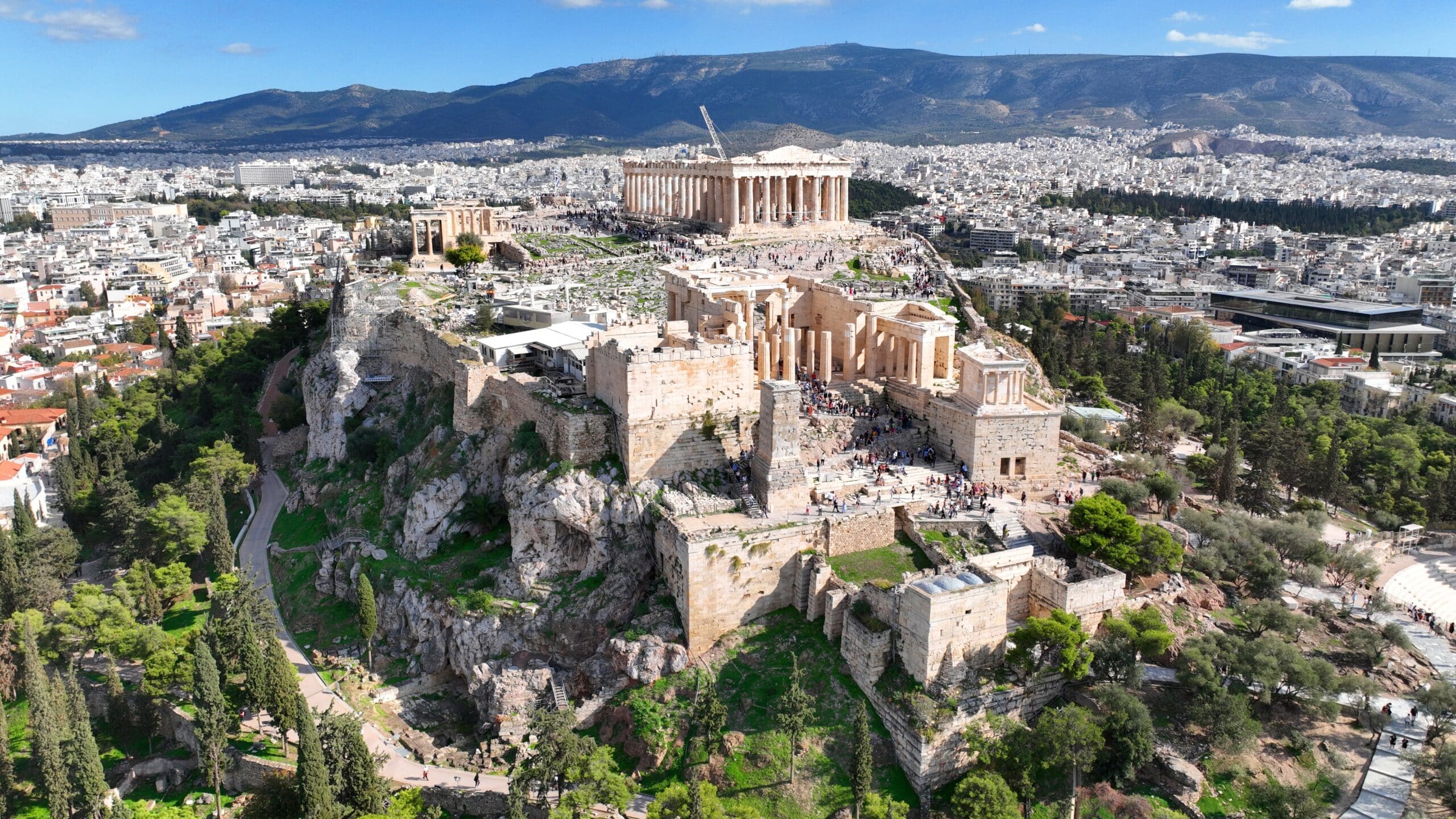 Aerial drone photo of iconic Acropolis hill and the Parthenon featuring Erechtheion and Porch of the Caryatids, Athens historic centre, Attica, Greece