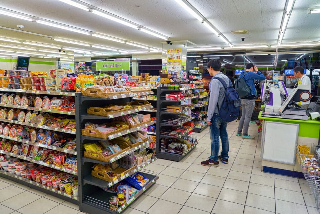 Interior of a convenience store in South Korea with snacks, drinks, and ready-to-eat meals