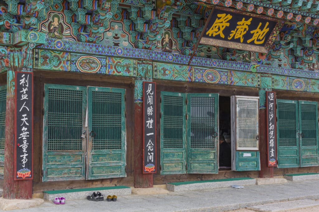 Traditional Korean temple building with shoes placed outside the entrance in South Korea