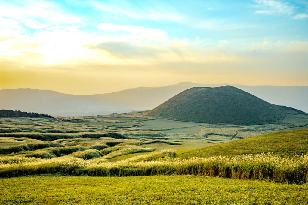 Aso region volcanic landscape with rolling hills and wide open scenery