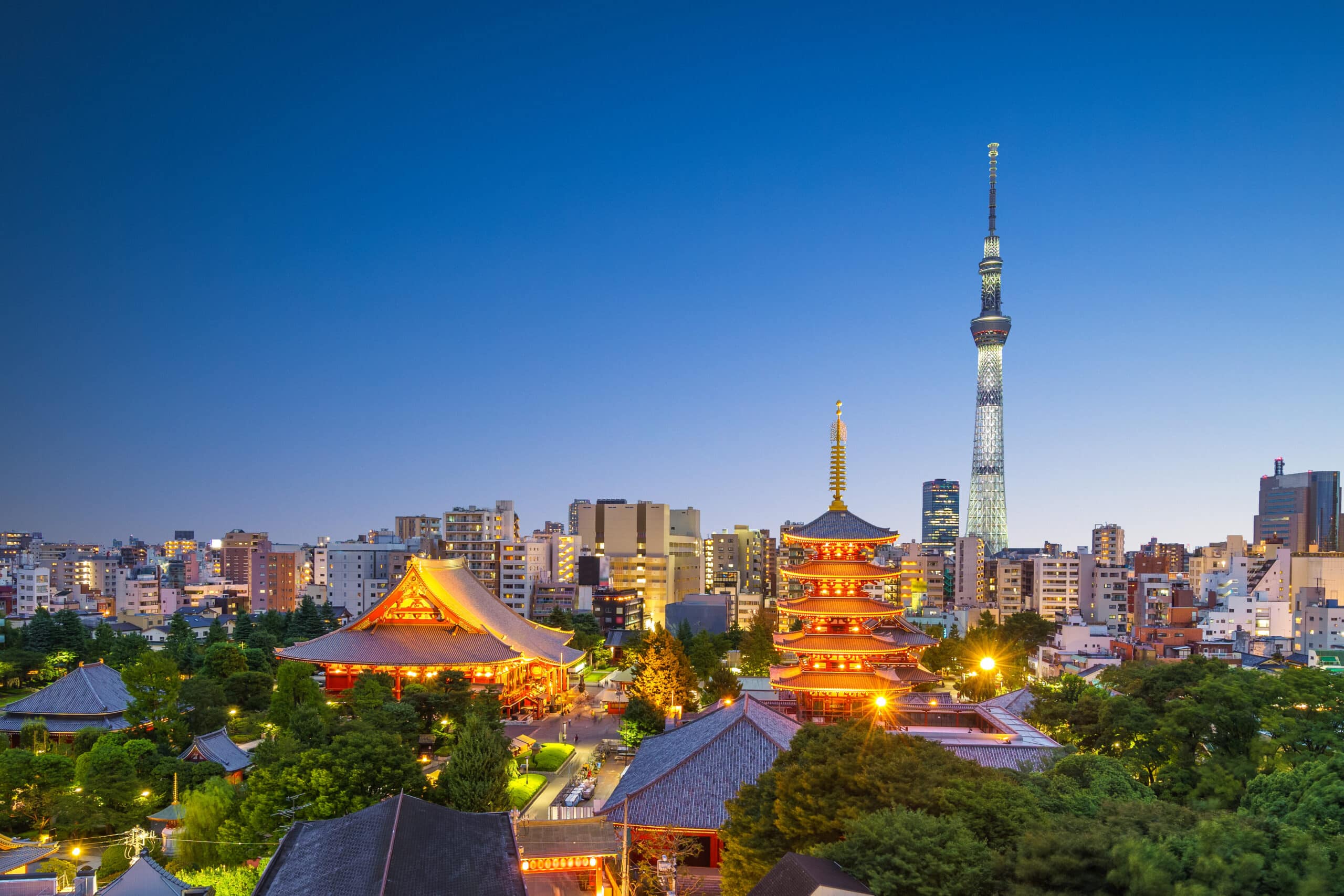 Senso-ji Temple and Tokyo Skytree skyline at dusk in Tokyo, Japan