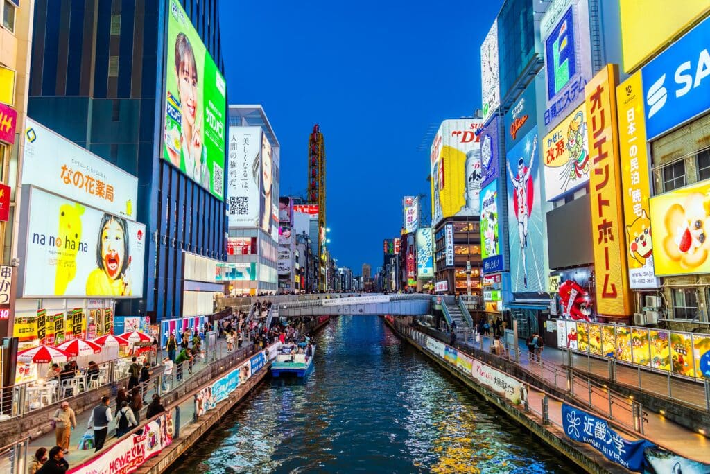 Dotonbori canal and neon signs at night in Osaka, Japan
