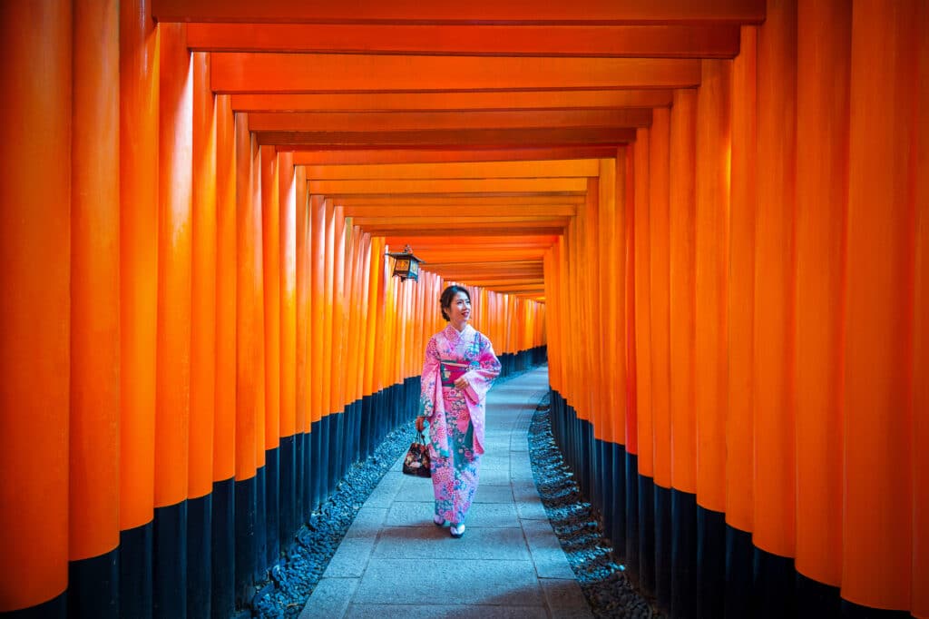 red torii gates tunnel at Fushimi Inari Shrine in Kyoto