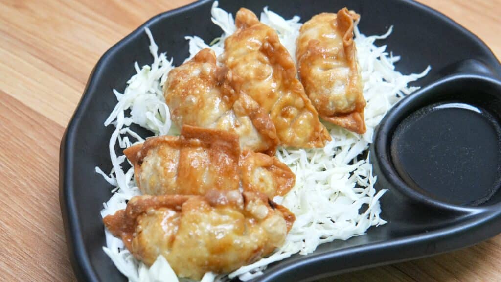 Japanese gyoza dumplings fried and served with dipping sauce