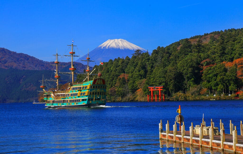 Hakone sightseeing boat on Lake Ashi with Mount Fuji in the background in Japan