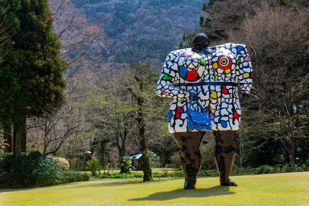 Colorful modern sculpture at Hakone Open-Air Museum surrounded by nature