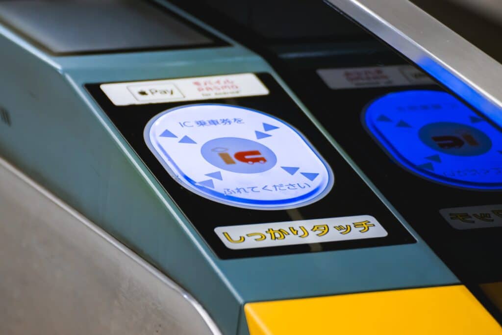 Close-up of a Japanese train station ticket gate with IC card tap area