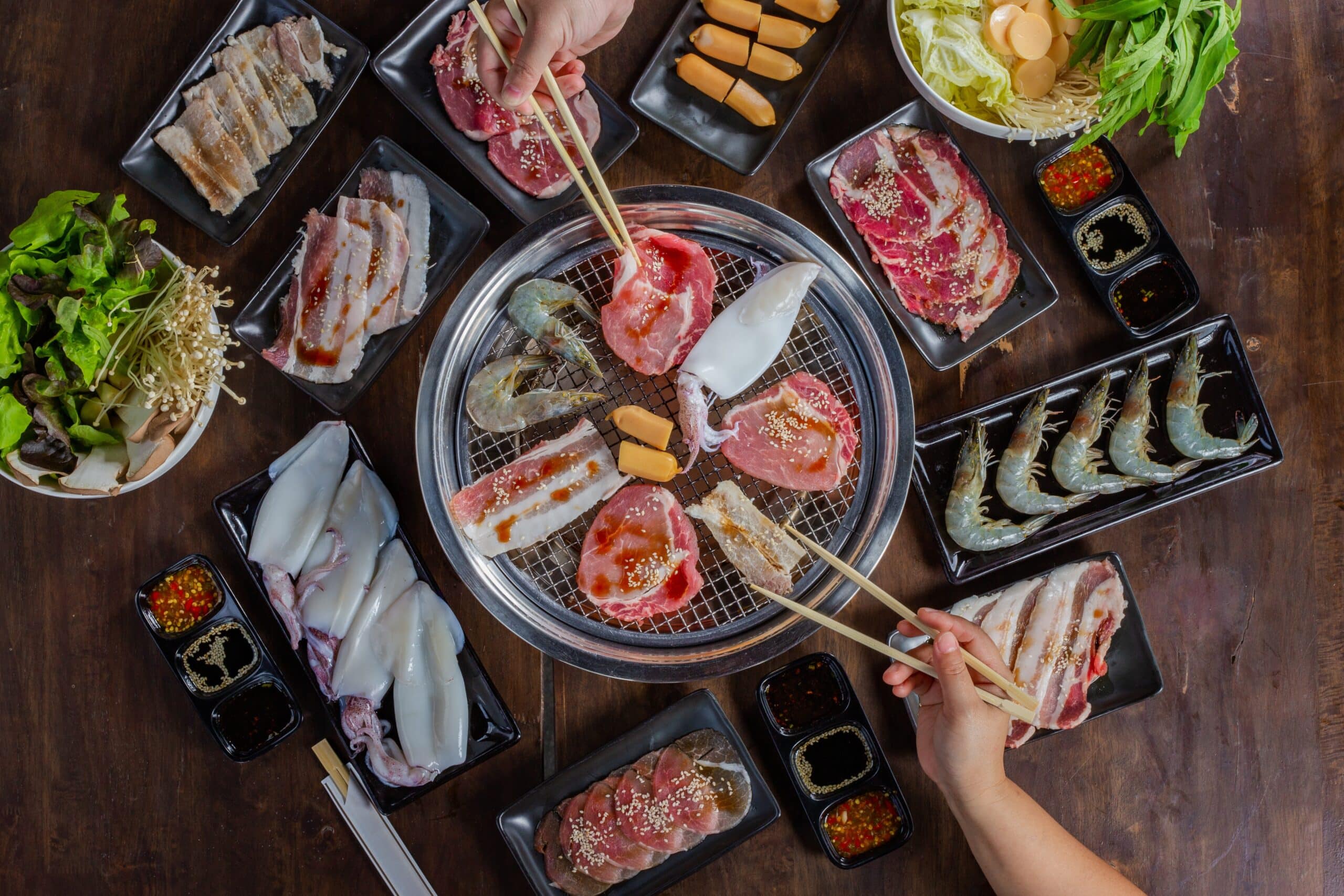 Japanese yakiniku barbecue with meat seafood and vegetables grilled on charcoal