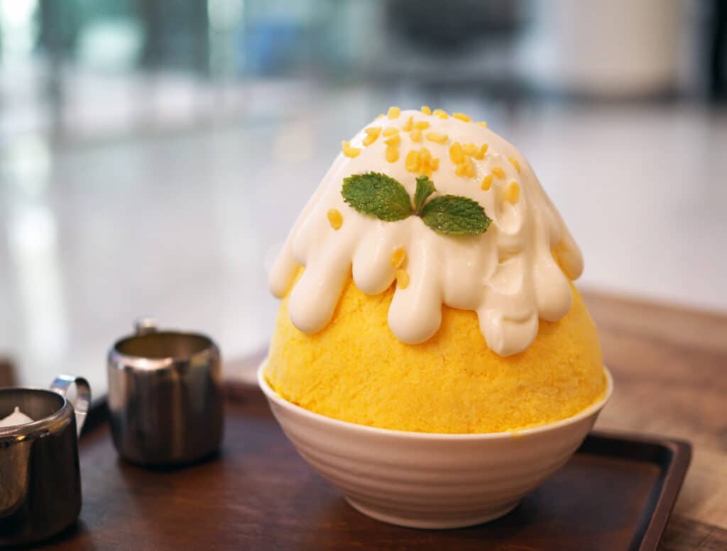 Kakigori Japanese shaved ice topped with cream and mint