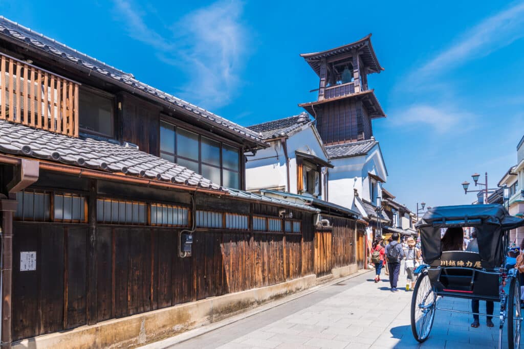 Traditional warehouse street in Kawagoe with historic buildings and rickshaw