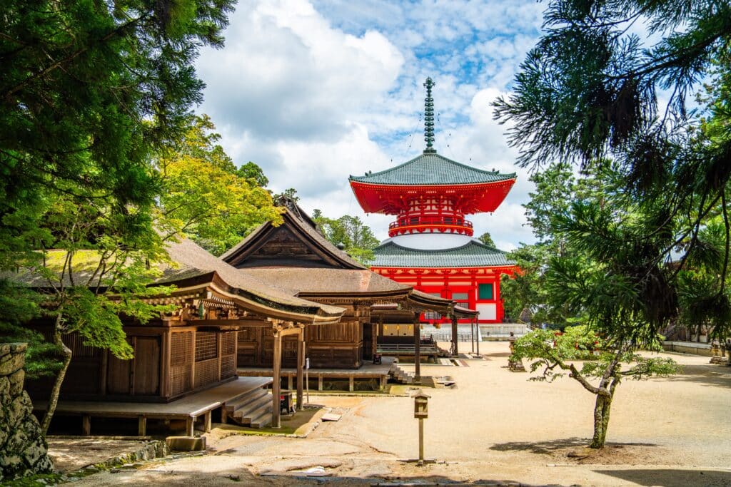 Temple complex in Koyasan with traditional architecture and forest surroundings