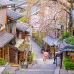 traditional Kyoto street in Higashiyama with cherry blossoms and wooden houses