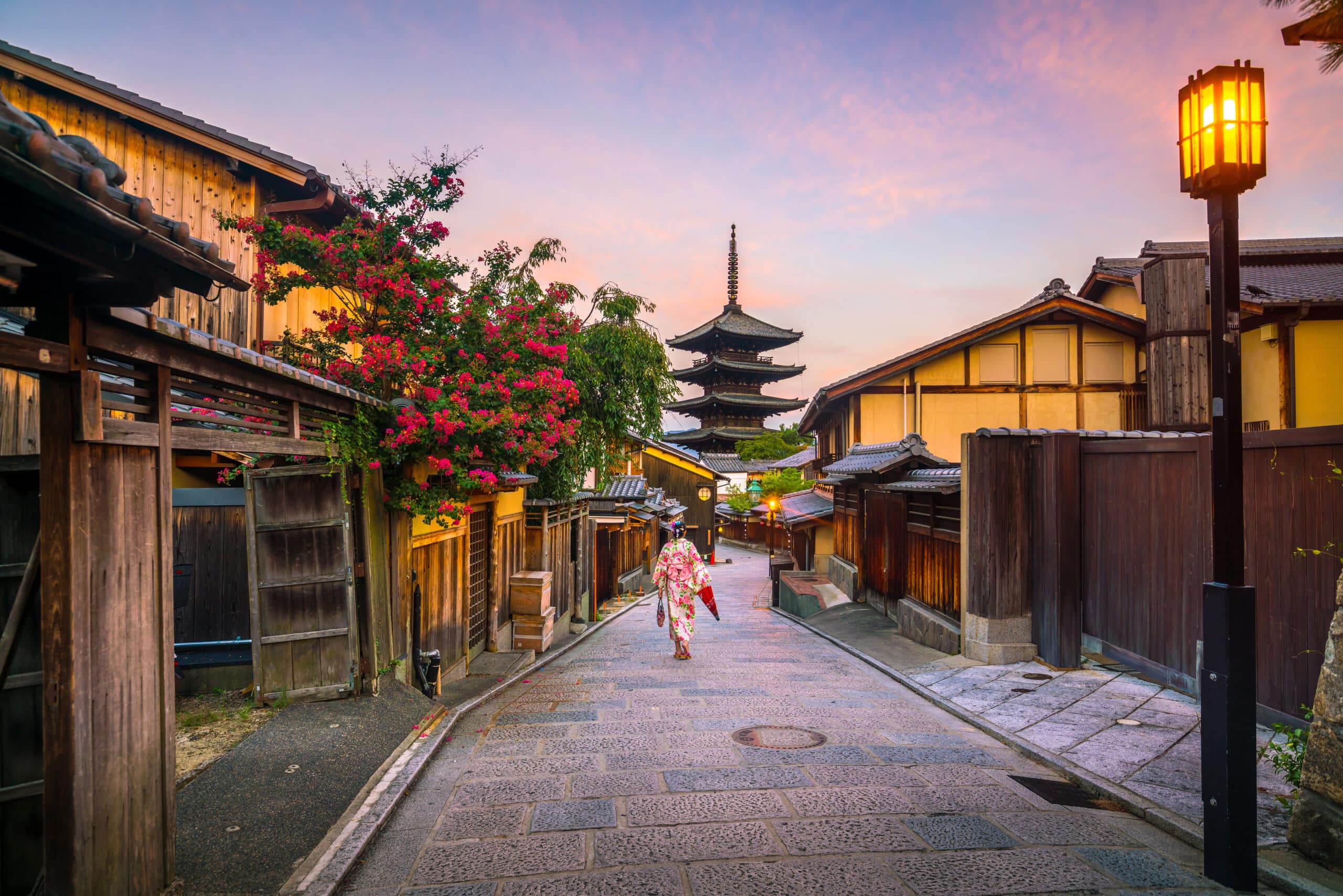 Kyoto old town street with pagoda at sunset