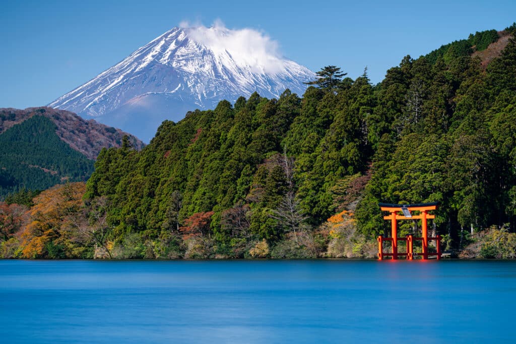 Red torii gate on Lake Ashi with Mount Fuji in the background in Hakone