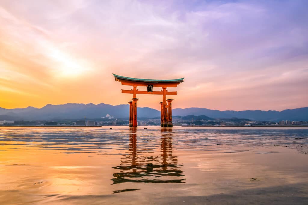 Floating torii gate at Miyajima during sunset in Japan