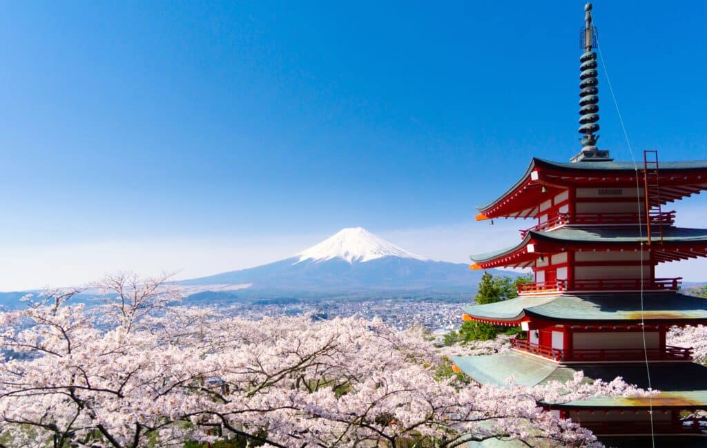 Chureito Pagoda with cherry blossoms and Mount Fuji in the background