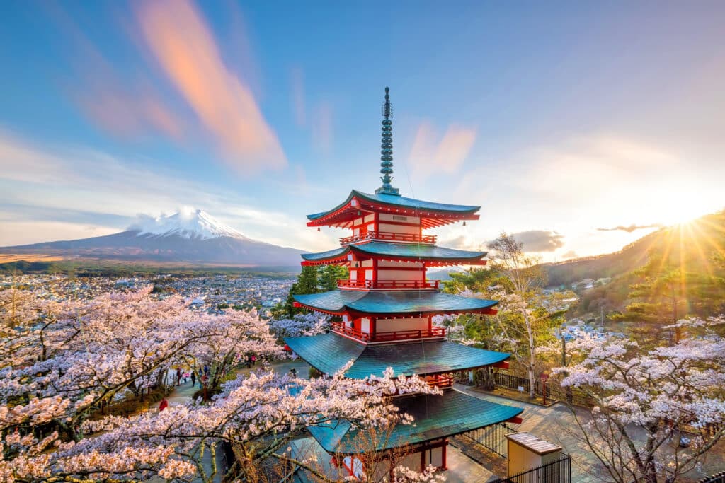 Chureito Pagoda with Mount Fuji at sunrise surrounded by cherry blossoms