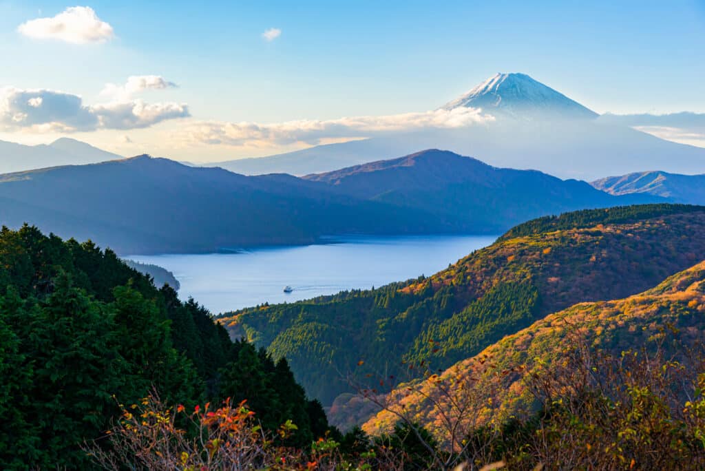 Mount Fuji rising above Lake Ashi with forested hills in Hakone