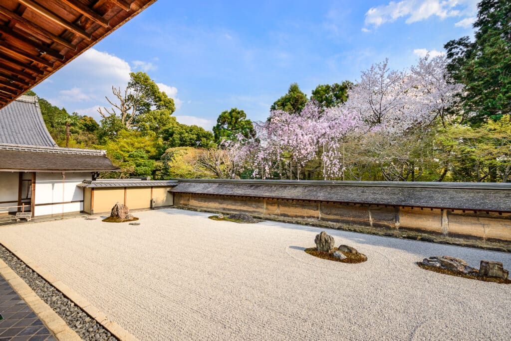Zen rock garden at Ryoan-ji Temple in Kyoto with raked gravel