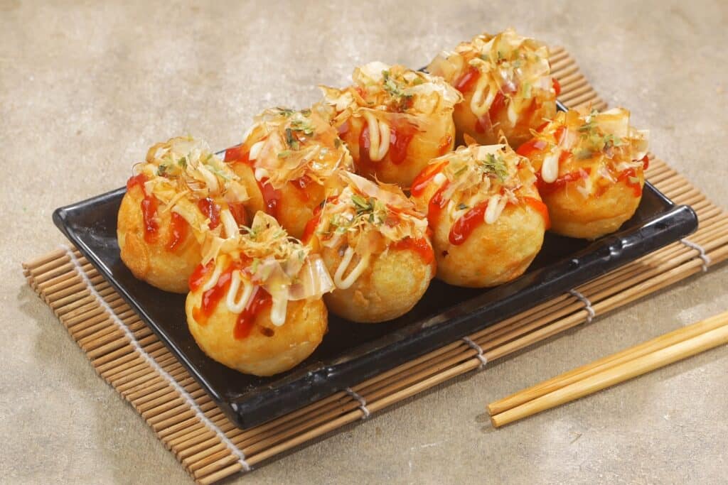 Takoyaki Japanese octopus balls topped with sauce, mayonnaise and bonito flakes