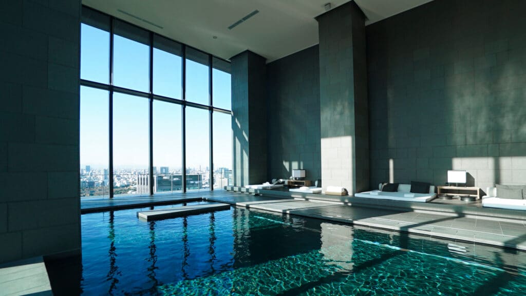 Luxury hotel indoor pool in Tokyo with panoramic city view