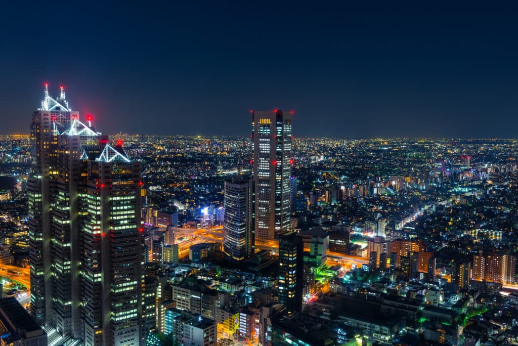 Tokyo skyline at night with illuminated skyscrapers in Shinjuku