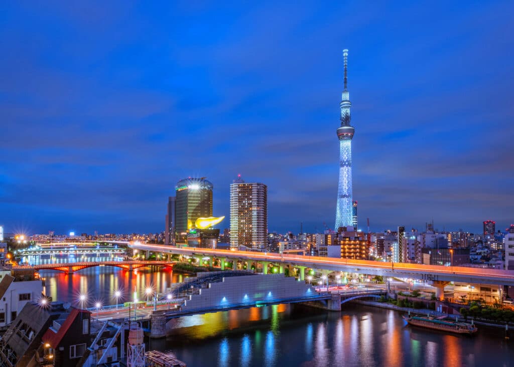 Tokyo Skytree illuminated at night with river and city lights