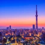 Tokyo Skytree rising above the city at sunset with Asakusa visible below