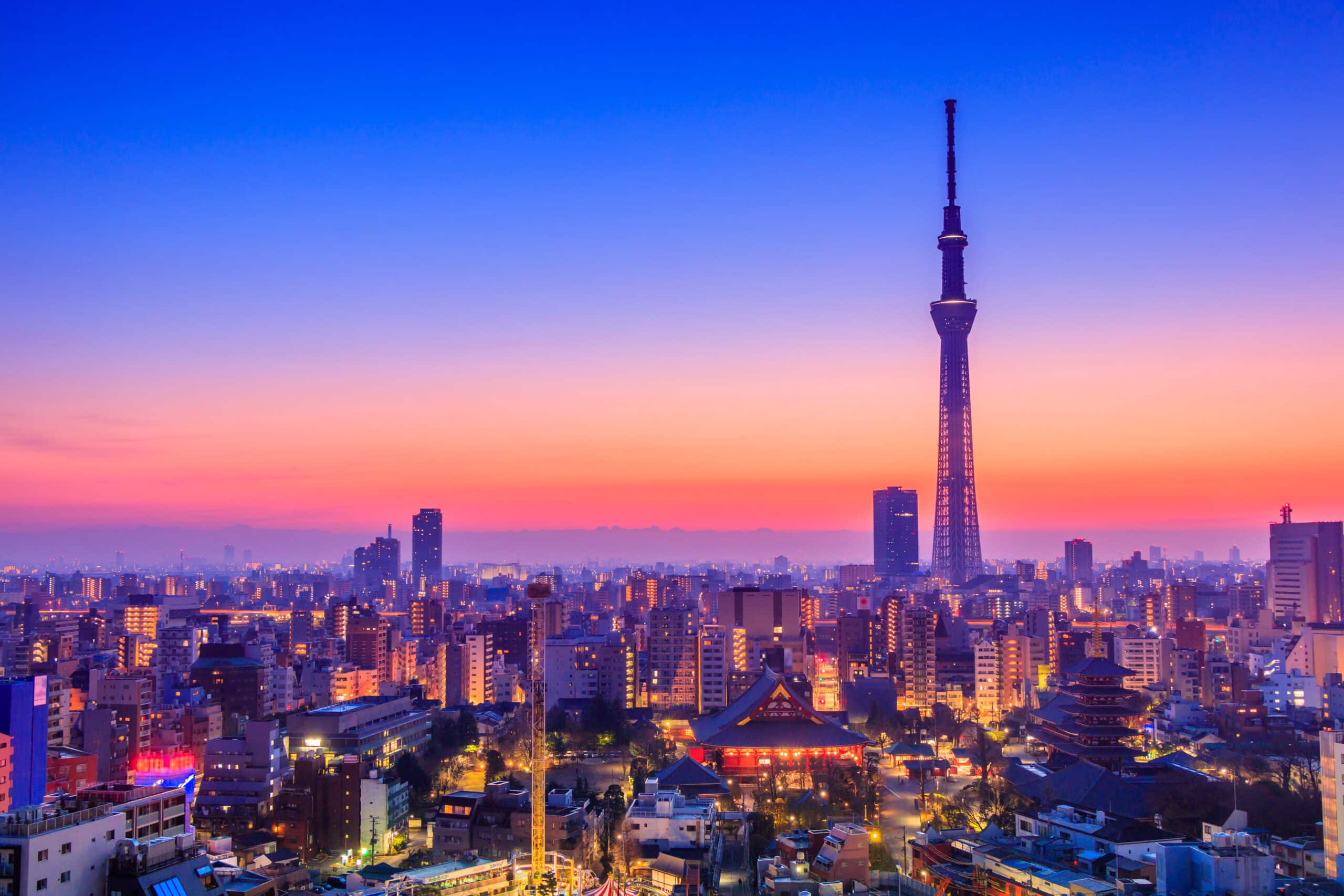 Tokyo Skytree rising above the city at sunset with Asakusa visible below