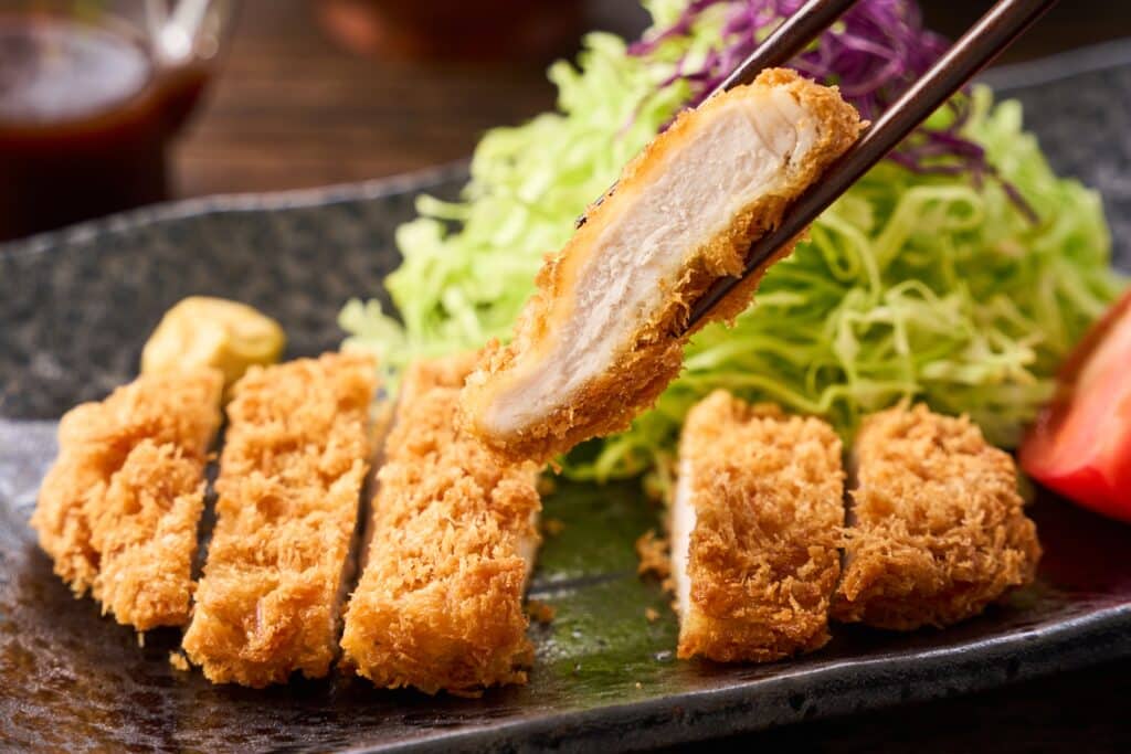 Tonkatsu crispy breaded pork cutlet sliced with cabbage
