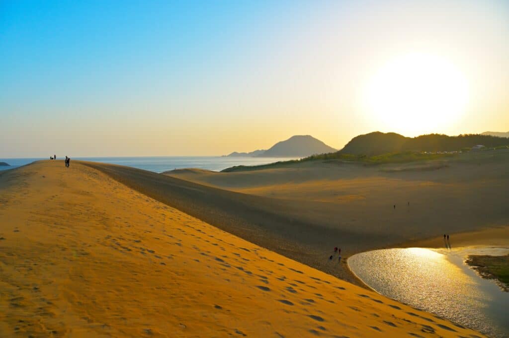 Tottori Sand Dunes at sunset with ocean view and rolling sand landscape