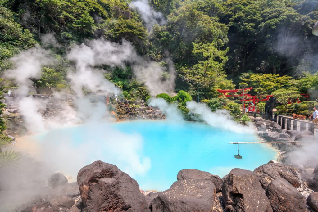 Steam rising from the bright blue hot spring at Beppu Hells in Kyushu