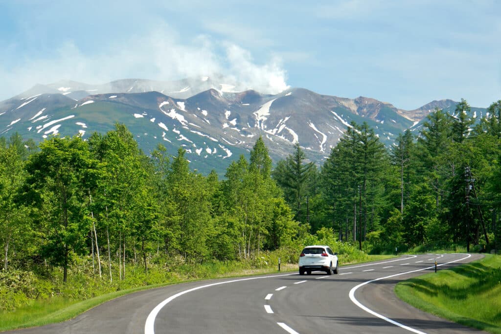 Scenic mountain road through Daisetsuzan National Park in Hokkaido, Japan