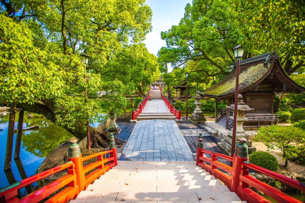 Red bridge and traditional buildings at Dazaifu Tenmangu Shrine near Fukuoka